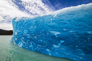 Blue iceberg floating in lake, glacial ice, Patagonia, Argentina
