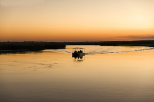 Boat in Okavango Delta in the evening, Botswana