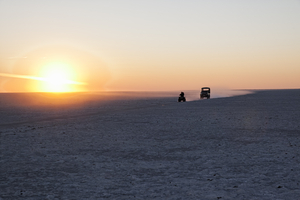 On the road with quad and jeep in the Makgadikgadi salt pan, Botswana