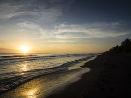 Sunset on the wild black beach of Tortuguero, Costa Rica, Central America