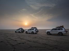 Off-road vehicle in salt desert at sunrise, Danakil Desert, Ethiopia, Africa