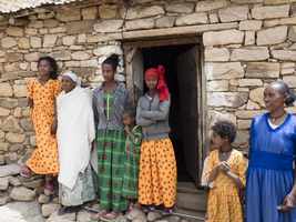 Family in front of a mud hut, Ethiopia, Africa