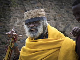 Old man with beard and yellow clothes, Ethiopia, Africa