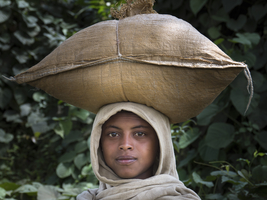 Girl carries with sack on her head, portrait, Ethiopia, Africa