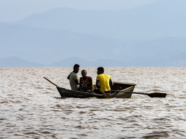Men in small boat on Lake Chamo, Ethiopia, Africa
