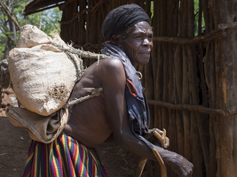 Old woman with a sack on her back, from the Konso tribe, Ethiopia, Africa