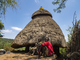 Residents in front of the hut in the village, Konso tribe, Ethiopia, Africa