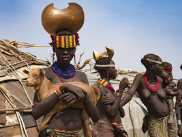 Women with goat in a Dassanech village, Ethiopia, Africa