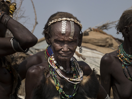Old woman with body jewelry in a Dassanech village, Ethiopia, Africa