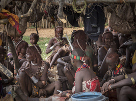 Men and women from the Hamar tribe, crowded into hut, Omo region, Ethiopia, Africa