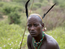 Young man from the Hamar tribe with feather headdress and necklace, portrait, Omo region, Ethiopia, Africa