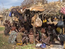 Men and women from the Hamar tribe, crowded into hut, Omo region, Ethiopia, Africa