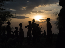 People from the Hamar tribe in the backlight in the evening, Omo region, Ethiopia, Africa