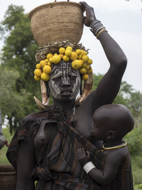 Woman with toddler and headdress from the Mursi tribe, Ethiopia, Africa
