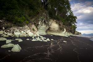 Black coast, green stones, Flores, Indonesia