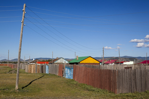 Village with fence and colorful houses, Mongolia