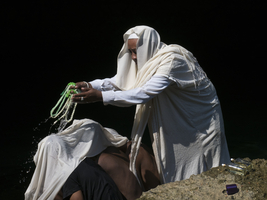 Healing ceremony with priest and water, Sarondrano, Madagascar
