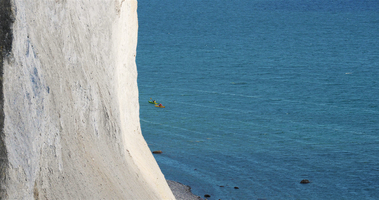 Chalk cliffs and view of the Baltic Sea, canoe paddler, island of Rügen, Germany