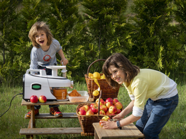 Children squeeze fruit juice, Germany