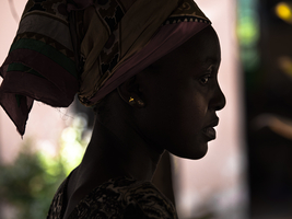 African woman with headscarf sensual in profile, Tanzania